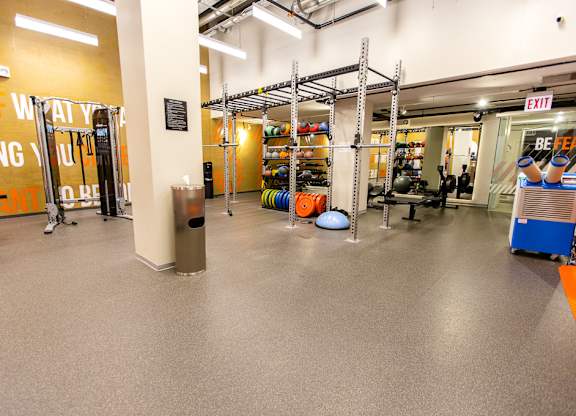 a workout room with weights and other equipment in a gym at The Kent, Illinois
