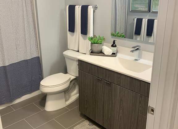 a bathroom with a sink and a toilet at Residences at Addison Clark Apartments, Chicago, IL
