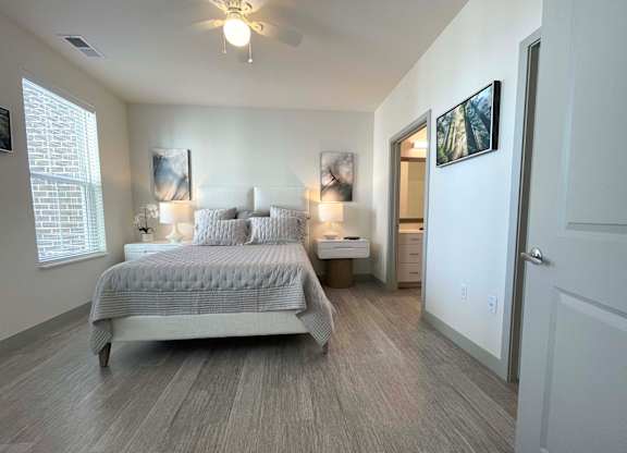 a bedroom with a bed and a closet at 42 Hundred On The Lake, St Francis, 53235