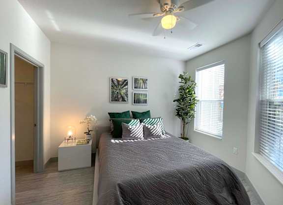 a bedroom with a large bed and a ceiling fan at 42 Hundred On The Lake, St Francis, WI, 53235