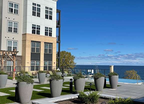 a view of the pool and Lake Michigan at 42 Hundred On The Lake, St Francis, 53235