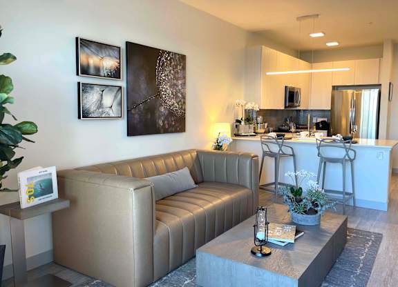 a living room with a couch and a table at 42 Hundred On The Lake, St Francis, WI, 53235