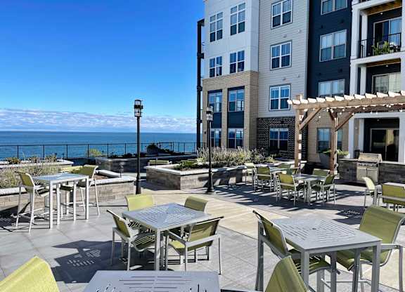 a restaurant or other place to eat on a patio overlooking the ocean at 42 Hundred On The Lake, Wisconsin, 53235