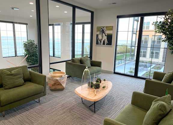 a living room with couches and chairs and a table at 42 Hundred On The Lake, St Francis