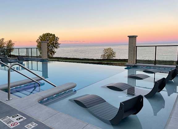 Pool view overlooking Lake Michigan at sunset at 42 Hundred On The Lake, St Francis, WI, 53235