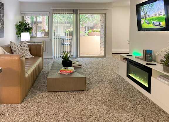 a living room with a couch and a tv at Fieldpointe of Schaumburg, Schaumburg, 60173