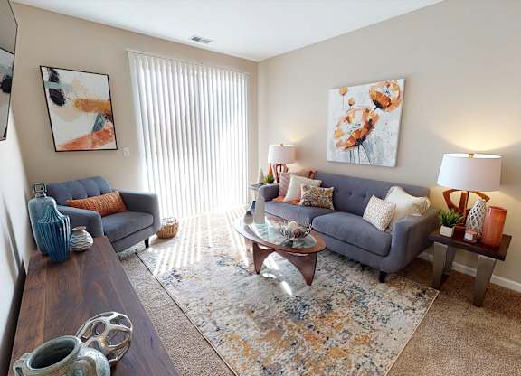 Spacious Living Rooms with Patio/Balcony at Landings at Amhurst Lake Apartments, Waukegan