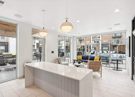 A white reception desk with a white counter and a white reception desk with a white counter and a white reception desk with a white counter and a white reception desk with a white counter and a white reception desk with a white counter and