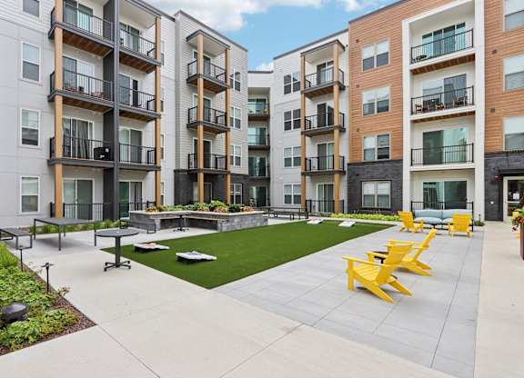A modern apartment complex with a shared outdoor space.