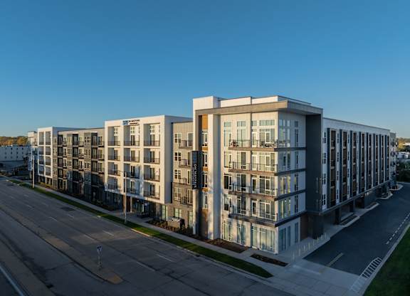 a rendering of a large apartment building on a city street at 2929 on Mayfair, Wauwatosa, WI