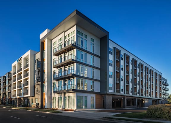 a large building with many windows and a street in front of it at 2929 on Mayfair, Wauwatosa