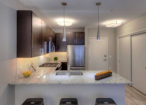 Kitchen with cabinets at Apex 41, Lombard, IL