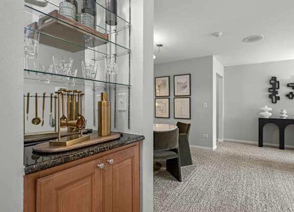 A kitchen with a counter and a chair.