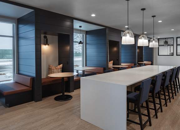 a long white counter in a restaurant with blue walls and chairs at 2929 on Mayfair, Wauwatosa, Wisconsin