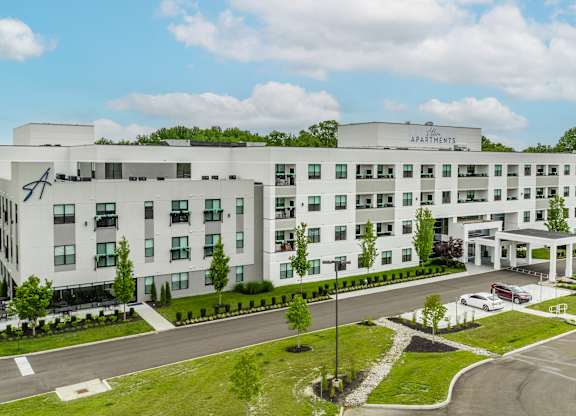A large white building with the Altura Sign