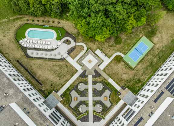 A large building with a pool in the middle of it.
