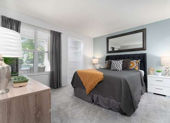 Spacious bedroom with a king-sized bed at Britton Woods Apartments in Dublin, Ohio