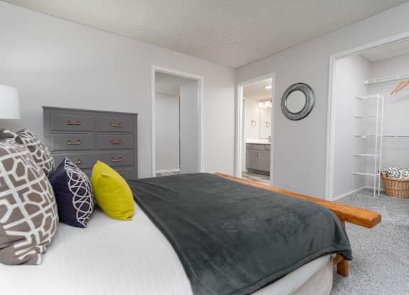 Bedroom with an en suite bathroom and closet space in a Britton Woods apartment