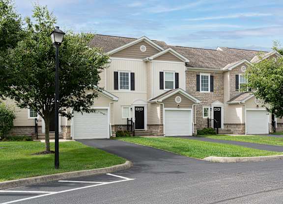 Row of attached homes with garages in Carson Farms’ welcoming neighborhood