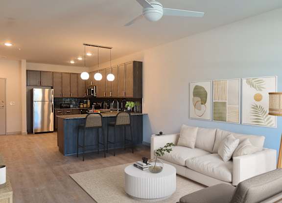 Altura Apartments kitchen equipped for culinary enthusiasts, adjacent to an expansive living room area.