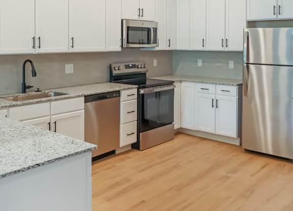 Altura Apartments chef-ready kitchen with dedicated pantry storage.