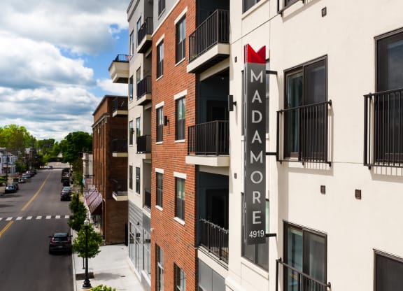Exterior shot of Madamore featuring buildings and apartment balconies.