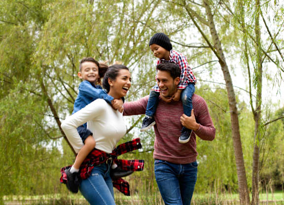 A family of four is having fun outdoors.