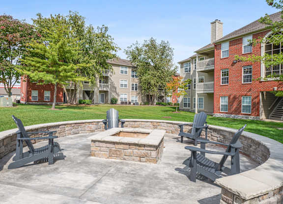 A firepit surrounded by four chairs at Reserve at Hamburg in Kentucky.