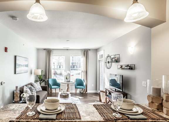 A well-lit dining area with a table set for two.
