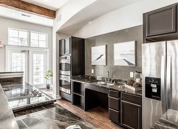 A modern kitchen with a black and white color scheme.