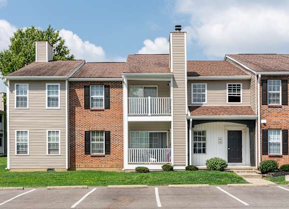 The Oaks exterior featuring apartment balconies and landscaped grounds.