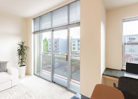 a living room with sliding glass doors to a balcony