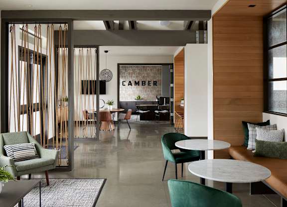 a room filled with furniture and a large window