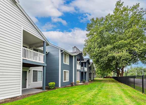 the preserve at ballantyne commons apartment community with blue and white houses and trees
