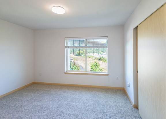 an empty room with a large window