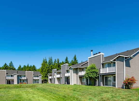 A row of houses with a blue sky above them.