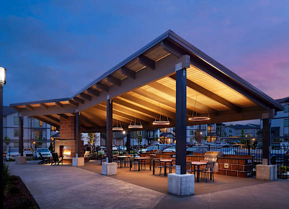 a rendering of a patio with awnings and tables