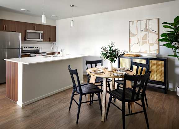 a kitchen and dining area in a 555 waverly unit