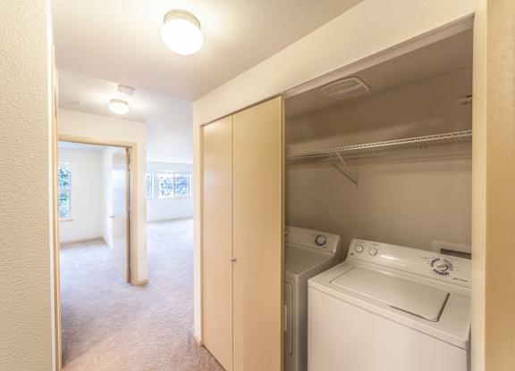 a room with a washer and dryer in it