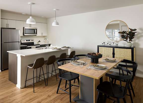 a kitchen and dining area in a 555 waverly unit