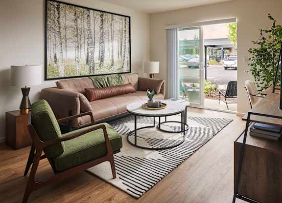 a living room with a couch chair and coffee table