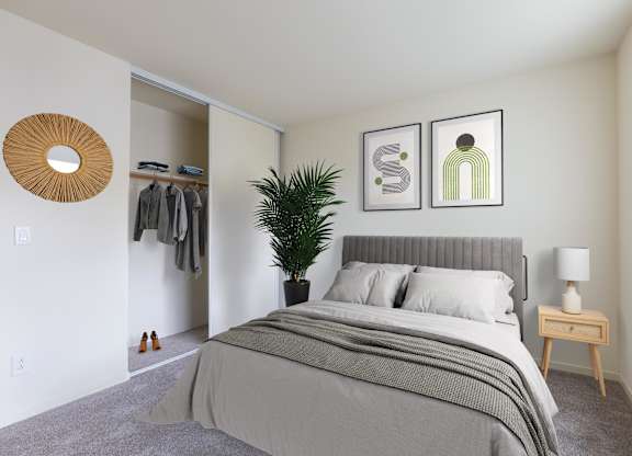 A bedroom with a large bed at Cherrywood Apartments, California