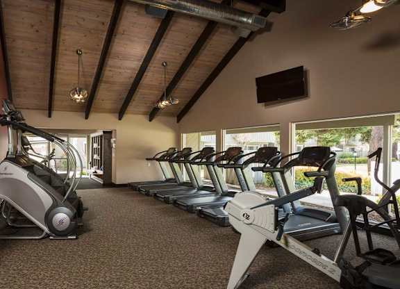 A gym with treadmills and exercise bikes at Cherrywood Apartments, San Jose, 95118
