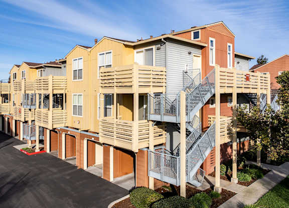 Apartment building with a staircase outside at The Woods Apartments, San Jose, California