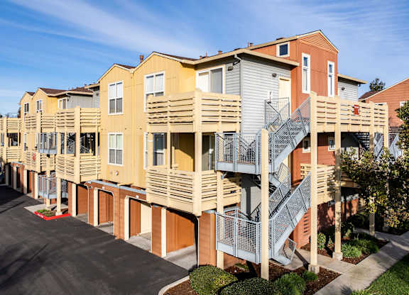 Apartment building with a staircase outside.