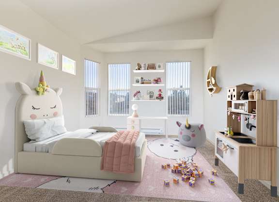 A unicorn headboard is on a bed in a child's room.