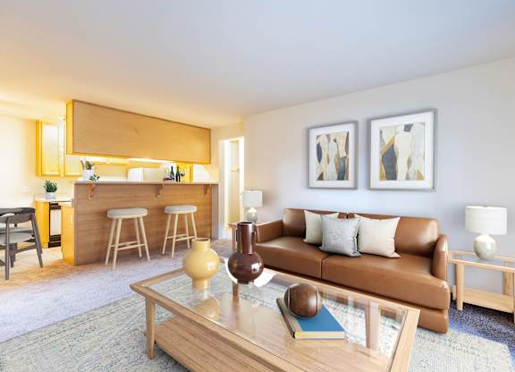 A living room with a brown couch and a coffee table at The Woods Apartments, California, 95136