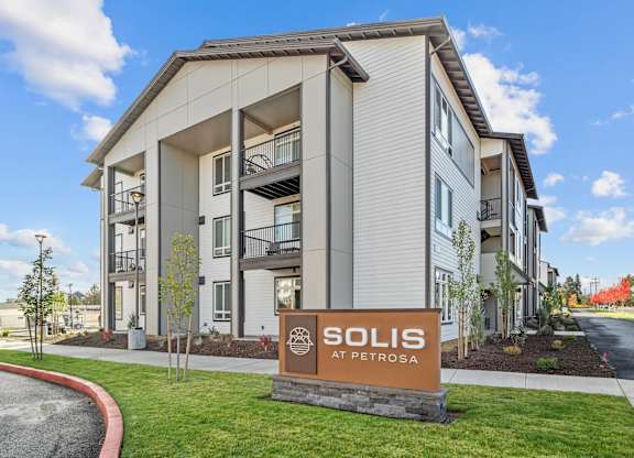 a building with a sols sign in front of it