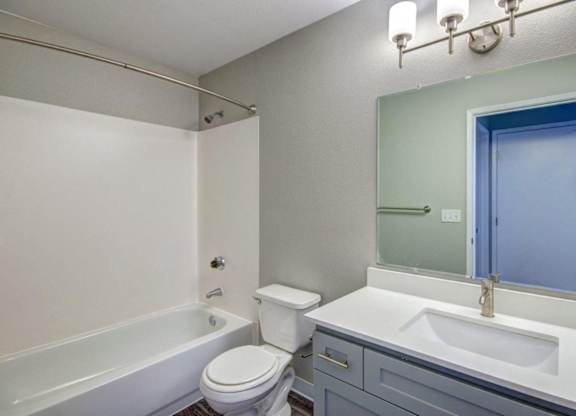 bathroom with tub and vanity at Clock Tower Village, DuPont, WA