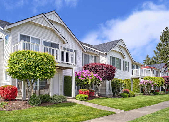 Apartment Building Exterior with Gorgeous Landscaping, and Sidewalks at Clock Tower Village, Washington, 98327